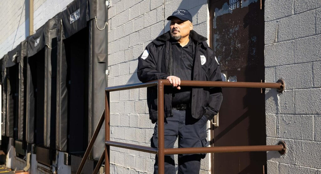 Unarmed security guard helping protect a building in Denver