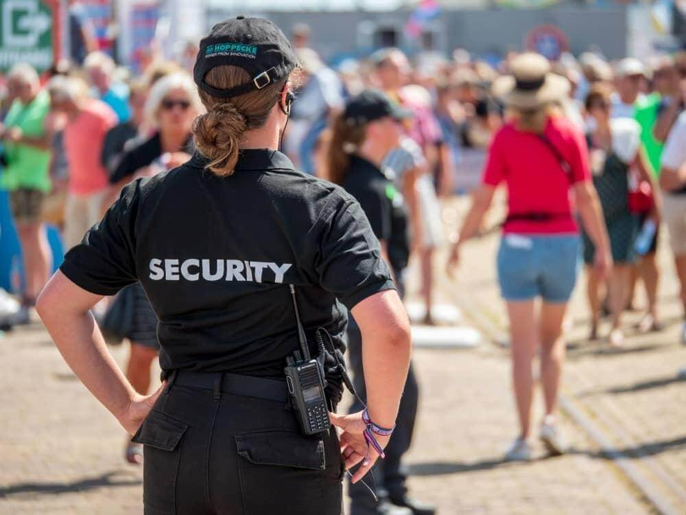 Event security guard monitoring a Denver venue after a large event