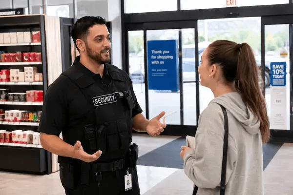 Grocery store security guard using de-escalation in a retail setting