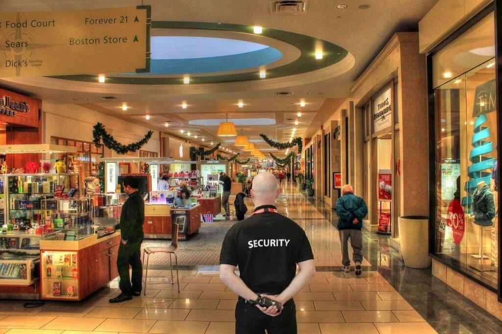 Denver security guard providing retail security services inside a shopping center.