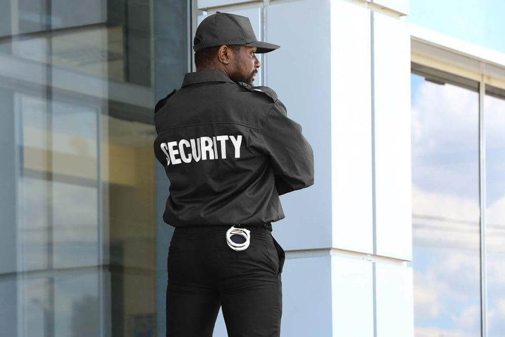 Unarmed security guard patrolling Denver corporate office exterior